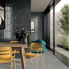 Dark glossy Gaia deco tiles on a dining room feature wall
