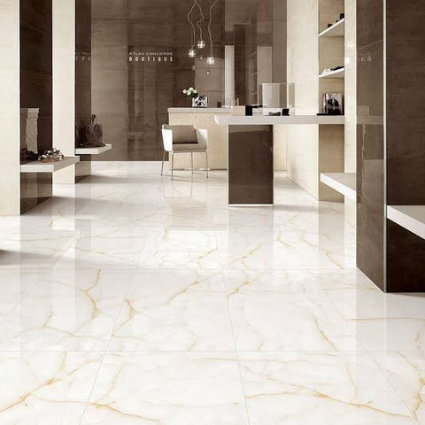 Large-format polished floor tiles in a modern interior space.