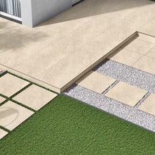 Cross-section of outdoor porcelain tile installation showing the bedding layers